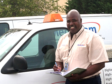 Mediacom employee at a van